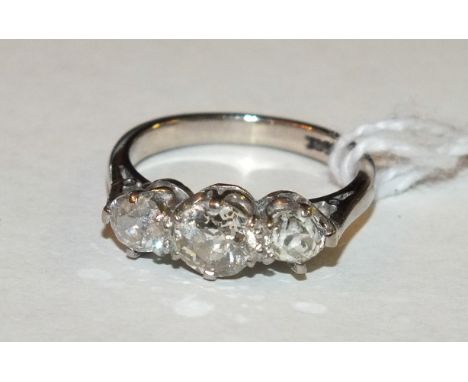 A three-stone diamond ring claw-set old brilliant-cut stones, totalling approximately 0.9ct, in 18ct white gold mount, size H