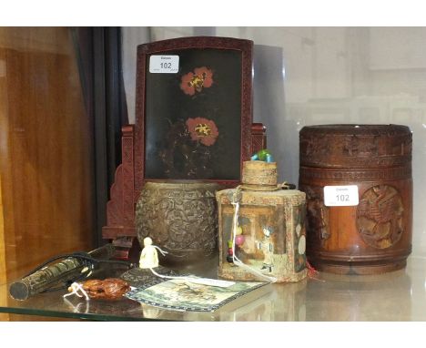 A carved Chinese bamboo box and cover, a similar coconut box with ivory finial, a tea caddy, a lacquer screen, a Chinese chop