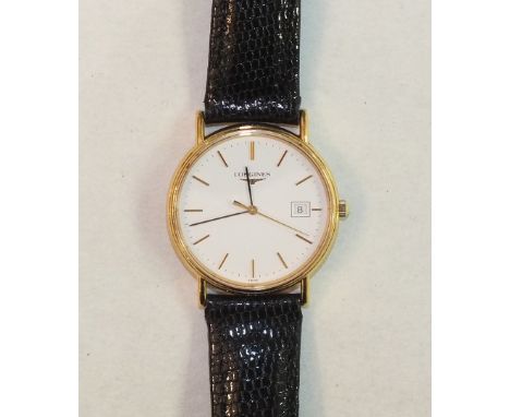 Longines, a gents gold-plated wrist watch, the white enamel dial with baton numerals, sweep seconds and calendar aperture, on