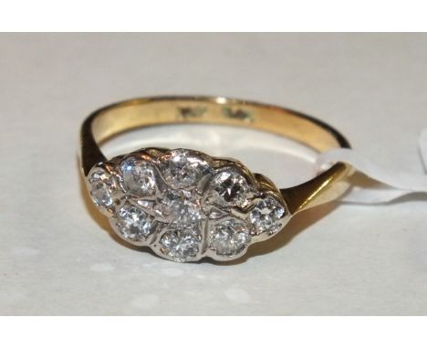 A diamond marquise cluster ring set nine brilliant-cut diamonds in 18ct yellow gold and platinum mount, size Q½, 3.7g.