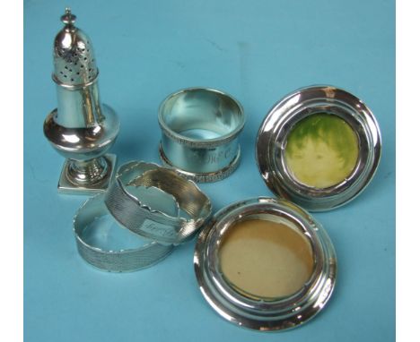 A pair of small circular photograph frames, 6cm diameter, London 1915, two engine-turned napkin rings and other small silver.