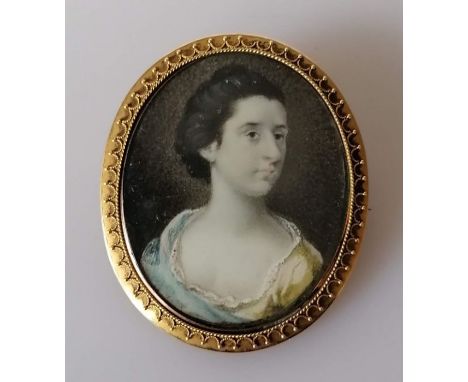 An early 19th century oval portrait miniature on ivory of Susan Metcalf, unsigned, in a gold frame, 45 x 35mm
