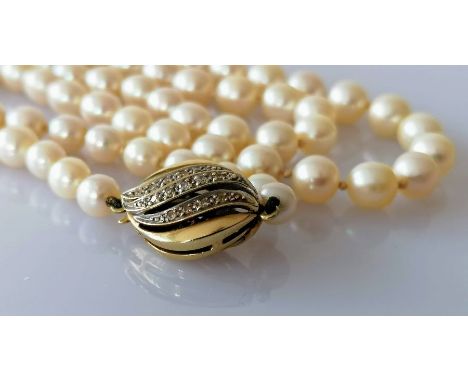A mid-century single row of eighty-three cultured pearls, measuring from 5.62mm to 9.05mm on a white and yellow gold clasp, s