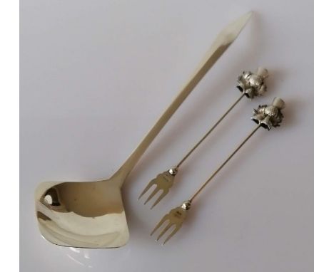 A mid-century silver ladle by S.P.R, hallmarked for London 1961, 21 cm and two silver pickle forks with thistle terminals by 