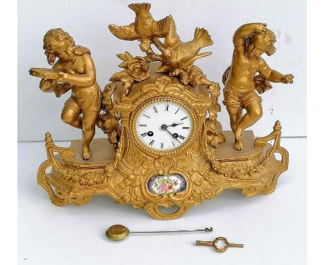 A 19th century French porcelain and ormolu mantel clock, the striking movement by Japy stamped for 'Berger a Paris 4500', the