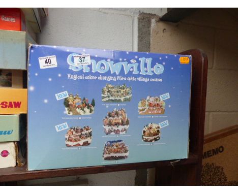 Snowville train with station colour changing fibre optic village scene model