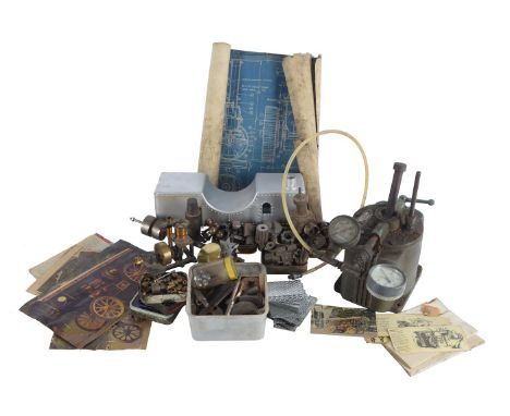 A sundry collection of engine parts, BA screws, water tank, hydraulic testing rig and a small model engine.