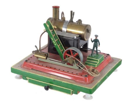 A Mamod live steam plant, with horizontal polished brass boiler having spirit burner and pipe-work linkage to oscillating hor