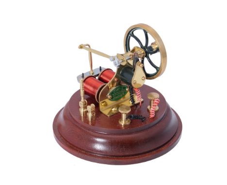 A small Old Model Company No 1 Rocking Engine, mounted on circular polished hardwood plinth. Serial No R464, The Old Model Co