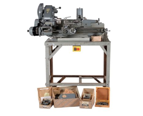 A full size Myford Super 7b metal working lathe, on non-commercial bench with fitted gear box, 4 inch self centre chuck, tool