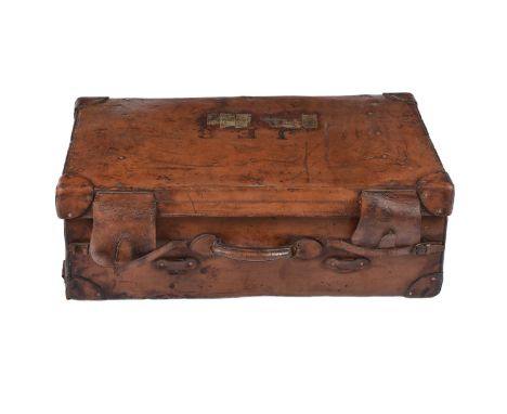 A leather steamer travelling case/trunk, formerly the property of John Edward Brown a maritime telegraph operator, the tan ex