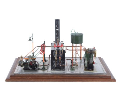 A model of a Stuart Turner live steam plant, having a Stuart Turner 501 horizontal live steam boiler set centrally on the pli