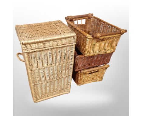A wicker hamper, height 60cm, and three further baskets.