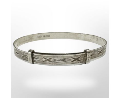 A silver child's expansion bangle, Albert Jackson, Birmingham 1909.