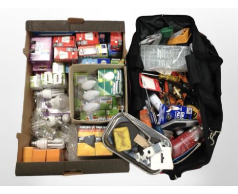 A tool bag and contents, together with a further box containing assorted light bulbs.