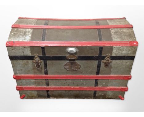 An early-20th century metal-bound dome-topped trunk, 80cm wide x 50cm deep x 55cm high.