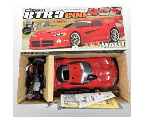 An HPI Racing RTR3 Evo 1/10th scale four-wheel drive nitro-powered RC car, in box.