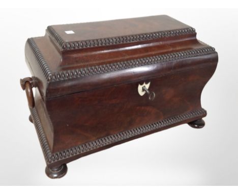 A reproduction mahogany tea caddy in the George III style, width 36cm.