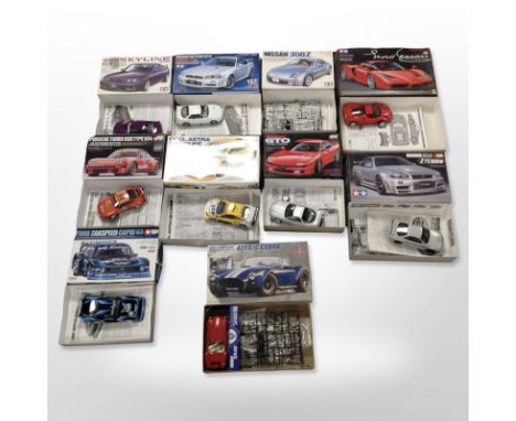 Nine Tamiya scale car modelling kits, and another Cobra kit. (1 box)
