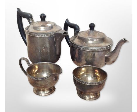A silver-plated four-piece tea service.