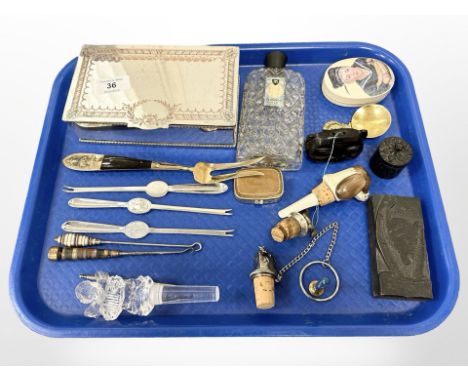 A group of collectables including wine stoppers, 1940's pefume bottle, shellfish picks, manicure tools, Viner's box, printing