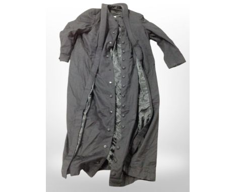 A full-length overcoat by Carl & Martin Larsen of Copenhagen.