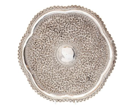 An early 20th Century Indian silver server, embossed floral decoration, diameter approx. 28cm, weight approx. 13.92 ozt