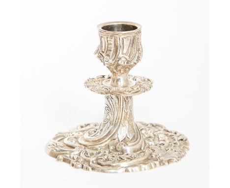 A Victorian desk candlestick, on circular base chase with profuse scrolling foliage and flowers, with acanthus leaf scone abo