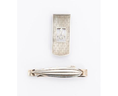 A modern silver tie clip in the form of&nbsp;Zeppelin on plain back, by JG?, London, 1990 together with modern money clip eng