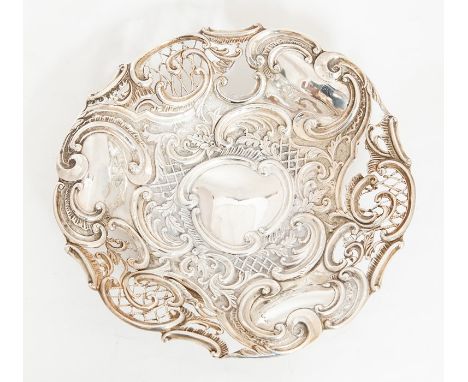 A Victorian silver circular fruit bowl, chased with scrolling foliage and openwork design, on raised circular foot, by Henry 