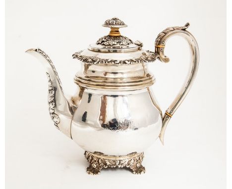 A George IV silver baluster shaped teapot, the apron cast with scrolling shells and foliage, above ribbed section plain body 