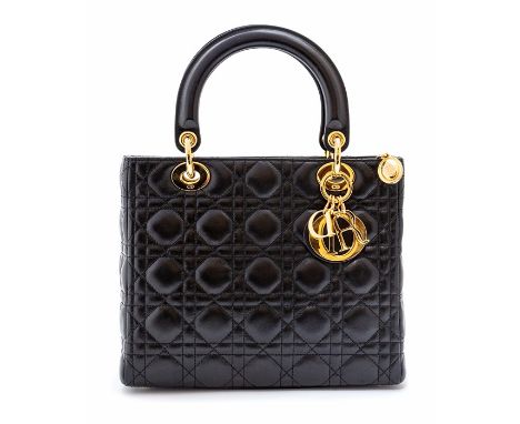 Dior - a Christian Dior Lady Dior handbag in black lambskin leather, cannage stitching with double carry handles, gold tone j