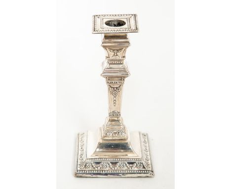 An Edwardian Neo-Classical style candlestick, detachable sconce, the base chased with swag tied paterae, by Fattorini Brother