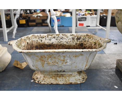 A Cast Iron Two Handled Planter with Armorial Relief Decoration, 63cm wide 