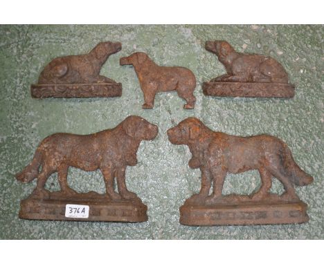 Vintage iron doorstops - two cast as St. Bernard dogs; three retrievers (5)