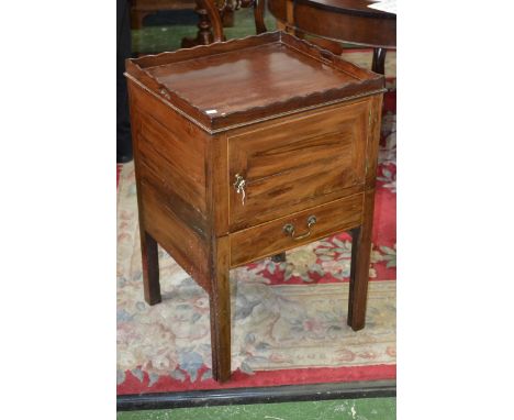 An early 19th century mahogany commode later converted to a pot cupboard, undulating gallery, crossbanded door to cupboard ov