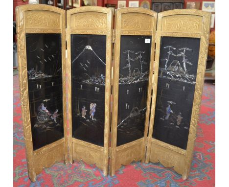 An oriental lacquered four fold firescreen.