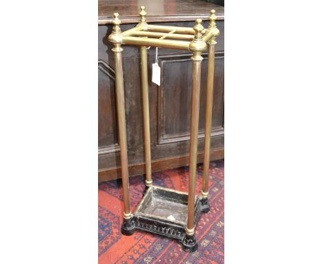 A Victorian brass and cast iron stick and umbrella stand