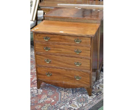 An early 19th century mahogany chest, of small proportions, oversailing top above four long graduated cockbeaded drawers, bat
