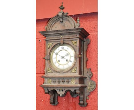 A late 19th Centruy architectural mantle clock domed pediment with lacquered brass finial, white enamel dial, twin winding ho