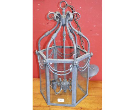 A large painted copper hexagonal ceiling lantern with bevelled panels