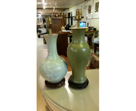 Two green ceramic chinese table lamps, PAT tested, wood bases. 33cm and 30 cm highCONDITION REPORT
The first lamp and taller 