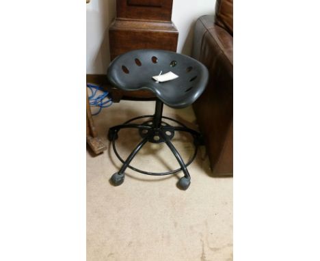 Tractor seat style, black, swivel stool on castors. Adjustable height.