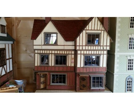 Large dolls house, in tudor style. This one is in three sections (per floor) so easy to transport. Complete with a huge quant