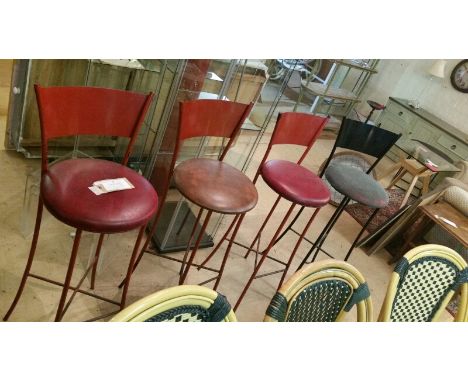 *4 vintage metal diner stools, tall bar stool style. 3 red, 1 black. One has a mis-shapen lower leg.  *this item will have VA