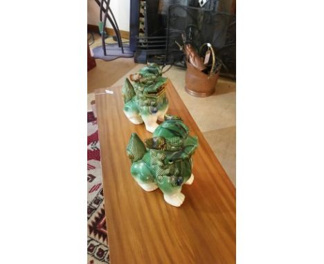 Pair of ceramic chinese foo dogs (lion guardians) in green tones
