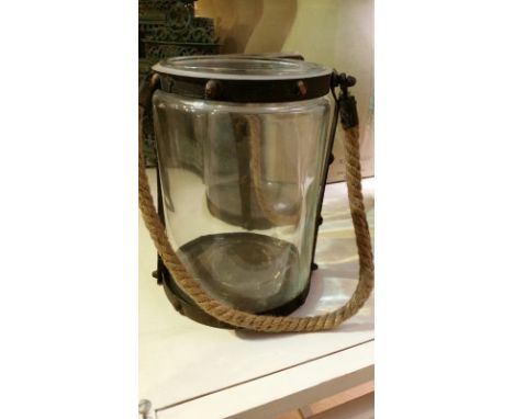 *Large glass hurricane lantern with distressed metal banding and rope handle, approx 27cm high, 20.5cm diameter  *this item w