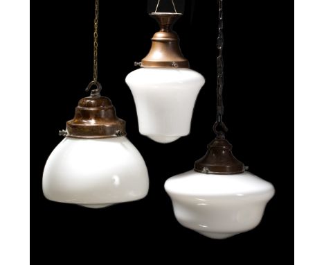 A GROUP OF THREE ART DECO WHITE GLASS AND COPPER MOUNTED HANGING CEILING LIGHT FITTINGS of various forms, the largest 22cm di