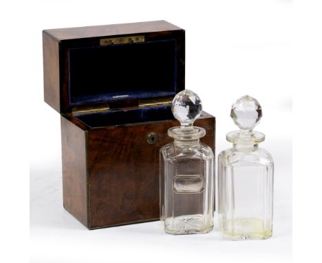 A VICTORIAN ARMY AND NAVY WALNUT AND BRASS MOUNTED DECANTER BOX with a Bramah lock and two cut glass decanters 21.5cm wide x 