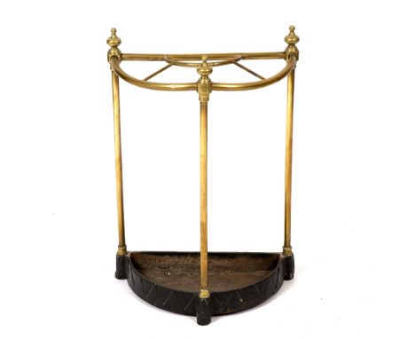 A VICTORIAN HALF ROUND BRASS AND CAST IRON STICK STAND with turned finials 42cm wide x 21cm deep x 61cm high 